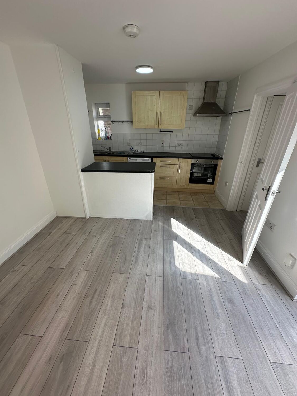 Kitchen space prepared with new flooring and units ready for fit